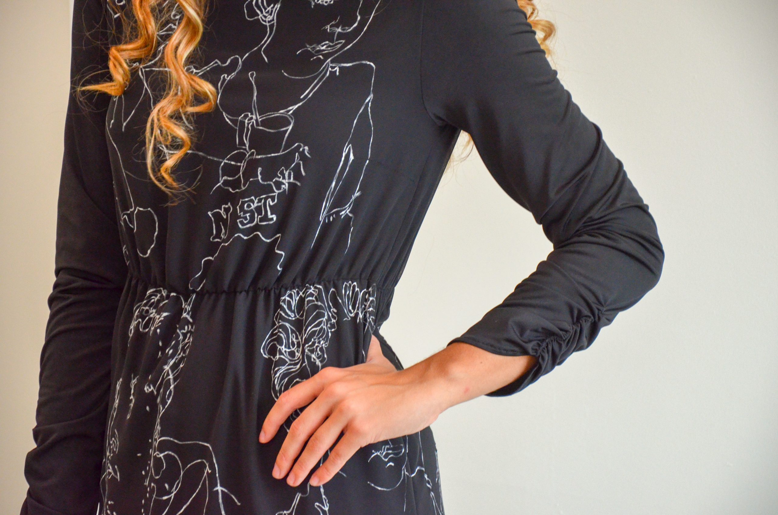 Black dress with hand made drawn white figure design III.