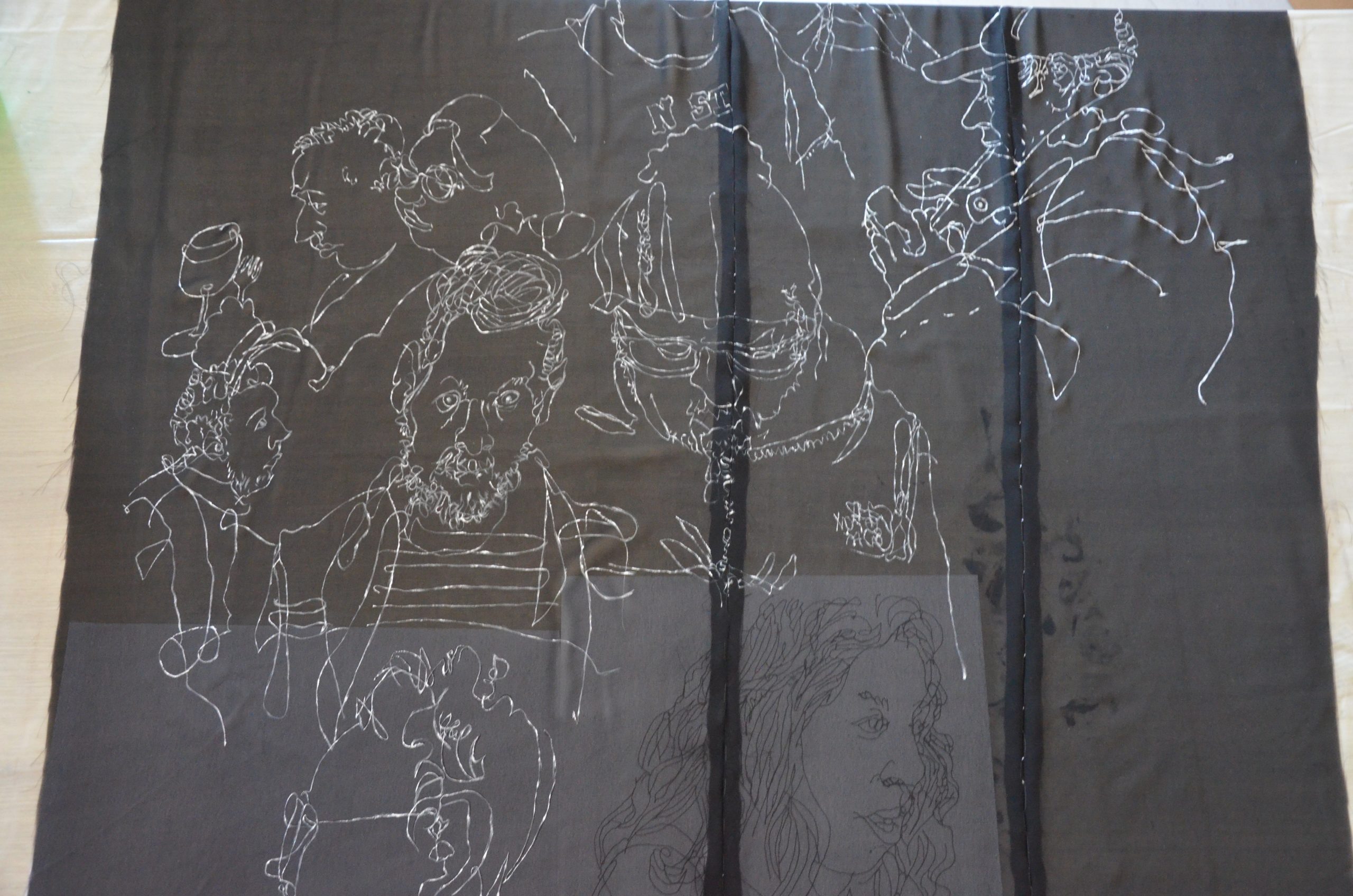 Black dress with hand made drawn white figure design V.